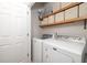 Bright laundry room features modern appliances and convenient shelving for ample storage at 3257 Timberline Dr, Johns Island, SC 29455