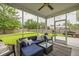 Relaxing screened porch with comfortable seating area and view of the backyard at 3257 Timberline Dr, Johns Island, SC 29455