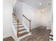 Inviting foyer features staircase with wood handrail and hardwood flooring at 3257 Timberline Dr, Johns Island, SC 29455