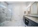 Bathroom with marble floors, glass shower, and double vanity at 357 Tupelo Lake Dr, Summerville, SC 29486