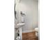 Compact powder room with a pedestal sink, modern fixtures, and clean lines, ideal for guests at 357 Tupelo Lake Dr, Summerville, SC 29486