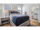 Bedroom with view of a ensuite bathroom, platform bed with storage drawers at 357 Tupelo Lake Dr, Summerville, SC 29486