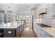 Modern kitchen with a center island, sleek countertops, and stainless steel appliances at 357 Tupelo Lake Dr, Summerville, SC 29486
