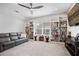 Comfortable living room featuring bookshelves, ceiling fan and carpet at 357 Tupelo Lake Dr, Summerville, SC 29486