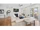 Spacious living room featuring a fireplace, lake views, and modern furniture for a comfortable and stylish living space at 357 Tupelo Lake Dr, Summerville, SC 29486