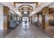 A community center lobby with high ceilings and a herringbone wood floor, showcasing the open and airy design at 357 Tupelo Lake Dr, Summerville, SC 29486