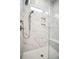 Modern marble shower with handheld shower head, built-in niche, and glass door at 357 Tupelo Lake Dr, Summerville, SC 29486