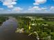 Aerial view of a property showing proximity to water, mature trees, and highlighting location with an arrow at 3627 Holmes Dr, Johns Island, SC 29455