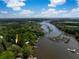 An aerial view displays the waterfront property, dock, and beautiful river access at 3627 Holmes Dr, Johns Island, SC 29455