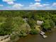 Beautiful aerial view showcasing two homes nestled among trees, with a private dock on the water at 3627 Holmes Dr, Johns Island, SC 29455