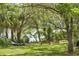 Backyard retreat offers benches, blue kayak, and lakeside access at 3627 Holmes Dr, Johns Island, SC 29455