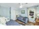 Cozy bedroom with hardwood floors, a ceiling fan, and a window offering natural light at 3627 Holmes Dr, Johns Island, SC 29455