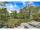 Inviting deck featuring lounge chairs and table, perfect for outdoor relaxation with scenic views at 3627 Holmes Dr, Johns Island, SC 29455