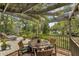 Covered deck provides wooden table set and lush green yard at 3627 Holmes Dr, Johns Island, SC 29455