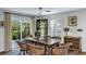 Dining area with a view of the backyard, with wooden table, chairs and glass display cabinet at 3627 Holmes Dr, Johns Island, SC 29455