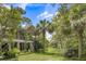 View of the back of the home with a deck and lush surroundings at 3627 Holmes Dr, Johns Island, SC 29455