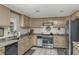 Well-lit kitchen features granite countertops, stainless steel appliances, and neutral cabinetry at 3627 Holmes Dr, Johns Island, SC 29455