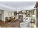 Inviting living room with a cozy fireplace, built-in bookshelves, and comfortable seating at 3627 Holmes Dr, Johns Island, SC 29455