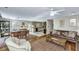 Open-concept living room and dining area with hardwood floors and ample natural light at 3627 Holmes Dr, Johns Island, SC 29455