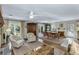 Spacious living room with a dining table, hardwood floors, and an open floor plan at 3627 Holmes Dr, Johns Island, SC 29455