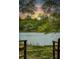 Beautiful waterfront view featuring serene water, green trees, and an amazing sunset to enjoy from the comfort of your home at 3627 Holmes Dr, Johns Island, SC 29455