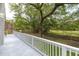 Enjoy the scenic views from this spacious back deck, surrounded by lush greenery at 37 Fort Royal Ave, Charleston, SC 29407