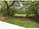 Enjoy peaceful backyard views of a marsh framed by lush trees from the deck at 37 Fort Royal Ave, Charleston, SC 29407