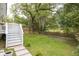 Spacious backyard with lush greenery and a white gate provides privacy and charm at 37 Fort Royal Ave, Charleston, SC 29407