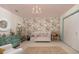 Serene bedroom featuring floral wallpaper, a white crib, and ample space at 37 Fort Royal Ave, Charleston, SC 29407