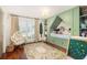 Charming bedroom with built-in bed, shelving, decorative accents and hardwood floors at 37 Fort Royal Ave, Charleston, SC 29407