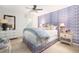 Stylish bedroom with patterned wallpaper, comfortable bed, and coordinated furnishings at 37 Fort Royal Ave, Charleston, SC 29407