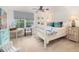 Comfortable bedroom featuring a four-poster bed, blue accents, and plenty of natural light at 37 Fort Royal Ave, Charleston, SC 29407