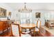 Formal dining area with bright natural light, hardwood floors and elegant chandelier at 37 Fort Royal Ave, Charleston, SC 29407