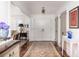 Inviting entryway featuring hardwood floors, area rug, decorative lighting, and access to multiple rooms at 37 Fort Royal Ave, Charleston, SC 29407