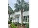 Close-up of the light-blue brick entrance featuring a meticulously landscaped garden with an inviting front door at 37 Fort Royal Ave, Charleston, SC 29407