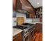 Gourmet kitchen featuring a professional-grade range, custom hood, and marble countertops at 37 Fort Royal Ave, Charleston, SC 29407