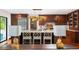 Spacious kitchen featuring dark wood cabinets, stainless steel appliances, and a large island with seating at 37 Fort Royal Ave, Charleston, SC 29407