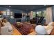 Cozy living room with a comfortable sofa, entertainment center, and treadmill at 37 Fort Royal Ave, Charleston, SC 29407