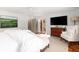 Serene main bedroom with seating area, hardwood floors, and a view into the ensuite bathroom at 37 Fort Royal Ave, Charleston, SC 29407