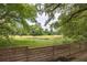Beautiful marsh view framed by a wooden fence and lush greenery creates a serene backdrop at 37 Fort Royal Ave, Charleston, SC 29407