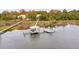 Stunning waterfront home featuring a private dock with boat lifts, surrounded by scenic marshlands at 4215 Ten Shillings Way, Ravenel, SC 29470