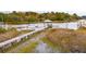 Scenic waterfront home with a private dock and boat lifts nestled in the tranquil marshlands at 4215 Ten Shillings Way, Ravenel, SC 29470