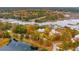 Beautiful waterfront homes with private docks and stunning fall foliage, showcasing serene coastal living at 4215 Ten Shillings Way, Ravenel, SC 29470