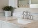 A close up shot of a bathroom vanity with marble counters and a chrome faucet at 4215 Ten Shillings Way, Ravenel, SC 29470