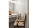 Bathroom vanity with a white marble countertop has a large mirror and a decorative chair at 4215 Ten Shillings Way, Ravenel, SC 29470