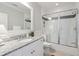 Bright bathroom featuring a subway tile shower with decorative accents and granite countertop at 4215 Ten Shillings Way, Ravenel, SC 29470