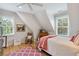 Bright bedroom with light hardwood floors, complemented by a plush rug and natural light from two windows at 4215 Ten Shillings Way, Ravenel, SC 29470