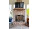 The outdoor brick fireplace is a stunning focal point on the covered patio at 4215 Ten Shillings Way, Ravenel, SC 29470