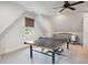 Spacious game room with a ping pong table and a Bedroom in a naturally lit room at 4215 Ten Shillings Way, Ravenel, SC 29470