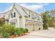 Spacious 4-car garage with a metal roof and mature landscaping at 4215 Ten Shillings Way, Ravenel, SC 29470